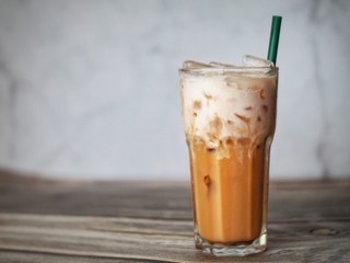 A glass of  Thai milk tea.