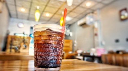 A glass of iced cola.
