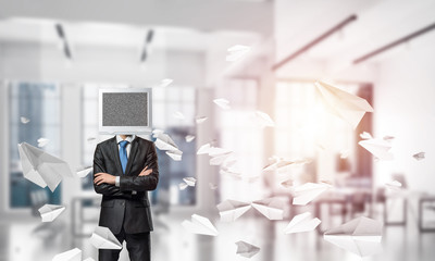 Businessman with monitor instead of head.