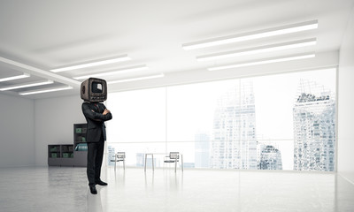 Businessman with an old TV instead of head.
