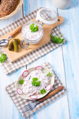 delicious homemade meat salad with mayonnaise and cucumber