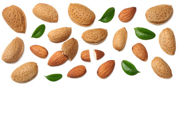 almonds with green leaves isolated on white background. top view.