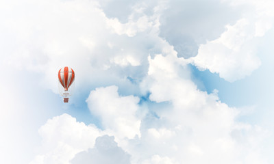 Fototapeta na wymiar Flying hot air balloon in the air.