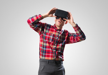 Guy in mask experiencing virtual reality as new entertainment device