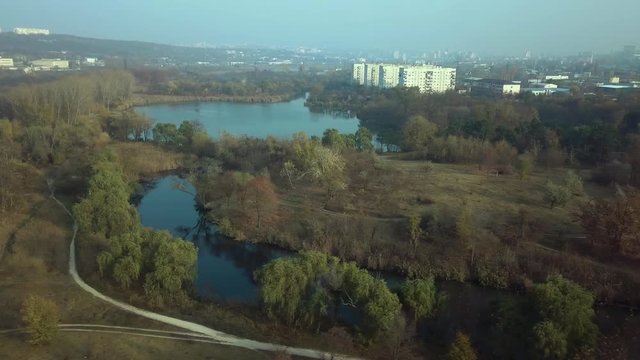 Aerial footage over Echo Park Lake, Kishinev, Moldova republic of. View of lake and smille bridge.