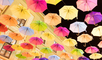 Fototapeta na wymiar Many multiple colors umbrella with night sky