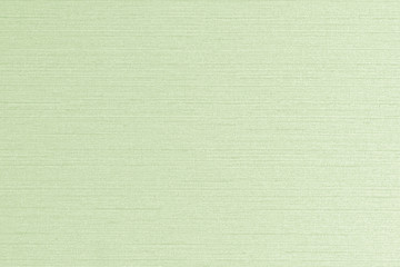 Cotton linen woven fabric texture background in light pale lime green color