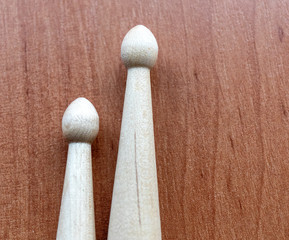 Two wooden drumsticks isolated on black background