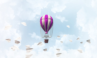 Flying hot air balloon in the air.