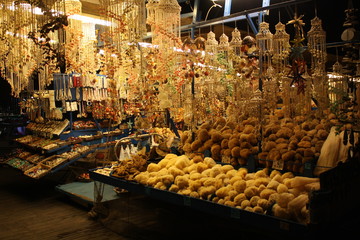 Market on boat with sea thinks in Greece