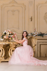 Woman in gorgeous pink long evening chiffon dress, fashionable romantic trend for ladies 