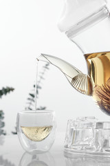 Hot flower tea in glass pot