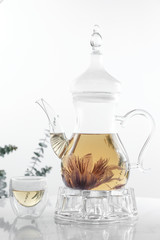 Hot flower tea in glass pot