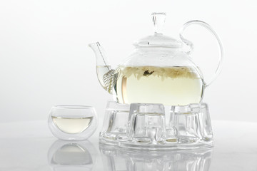 Hot flower tea in glass pot