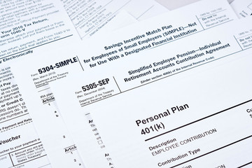 Tax reporting and retirement plan. Personal plan 401k form on against background 5304-simple, 53050-sep tax form and other forms
