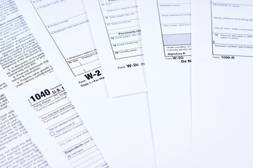 Obraz premium Tax Forms 1040, w-2, w-2c, w-2g, 1099r on background other forms