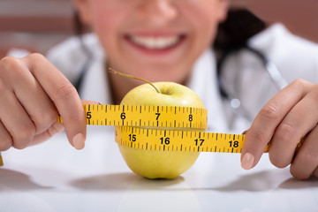 Dietitian Measuring The Apple