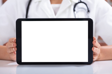 Doctor's Hand Holding Digital Tablet With Blank White Screen