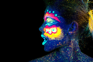 The woman portrait blue face, aliens asleep, ultraviolet make-up. Beautiful. woman screaming in profile	