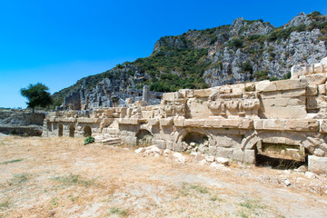 Ancient lycian necropolis with tomb carved in rocks in Mira