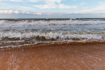 Calm waves on the beach. The storm is coming