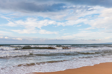Calm waves on the beach. The storm is coming