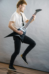 Fototapeta premium Man playing on electric guitar