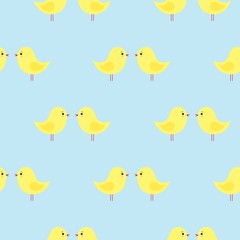 Vector seamless pattern with cute yellow Easter chickens on a blue background. kawaii