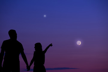 Couple under the Moon and Milky way stars. My astronomy work.