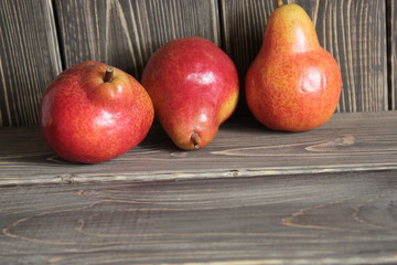Red, ripe pears on the table.