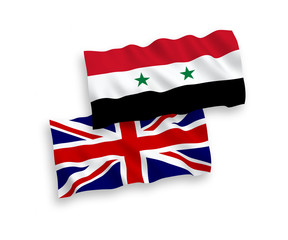 National vector fabric wave flags of Syria and Great Britain isolated on white background. 1 to 2 proportion.