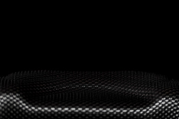 Kevlar, figured surface close-up, macro, shallow depth of field, on a black, dark background,...