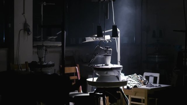 Action shot of an isolated sewing machine.
