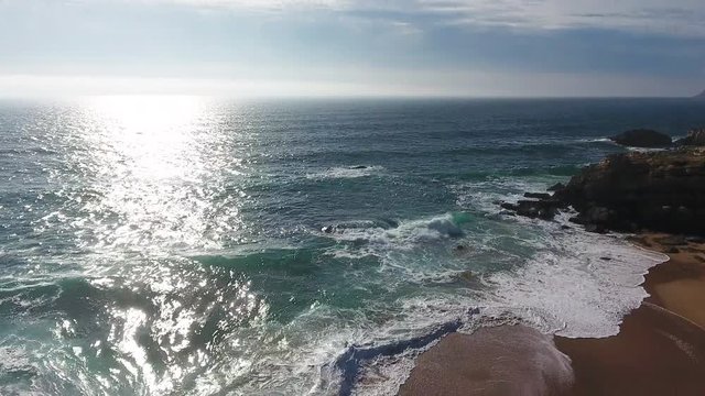 Aerial drone shot of a sunset in the sea.