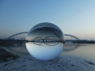 Morning landscape bridge in lensball