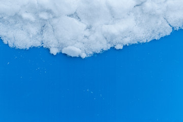 White snowy fields under a blue background
