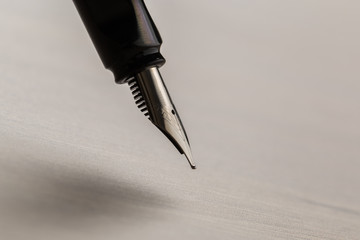 Black fountain pen on table