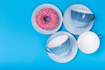 cups on a blue background top view