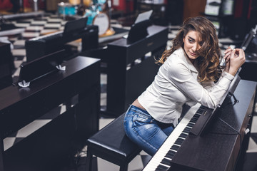 Young girl enjoys a musical instrument store