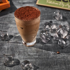 Chocolate frappe coffee outside on a summer day