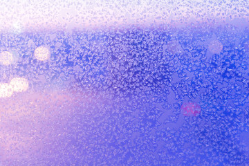 Frosty pattern on the glass. The figure is made of cold air.