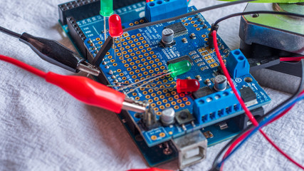 Microcontroller build closeup showing components, board and shield