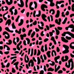Jungle seamless pattern with leopard skin ornament on pink background