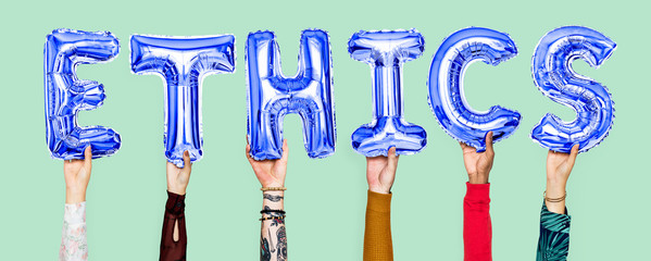 Hands holding ethics word in balloon letters