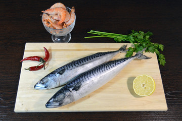 fresh mackerel on a wooden board