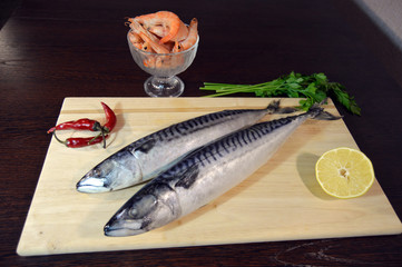 fresh mackerel on a wooden board