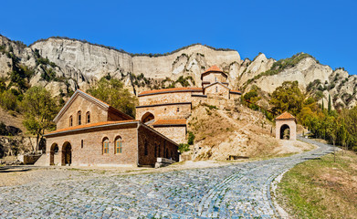 Fototapeta premium Mtskheta, Georgia. The Picturesque View Of Shiomgvime Or Shio-Mgvime Monastery, Medieval Monastic Complex In Limestone Canyon. Autumn.