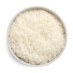 Coconut flakes in a bowl isolated on white background. Top view