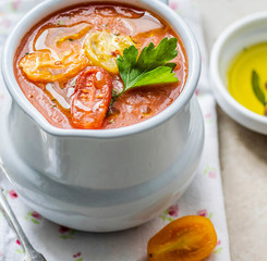 Freshly cooked tomato soup seasoned with parsley leaf