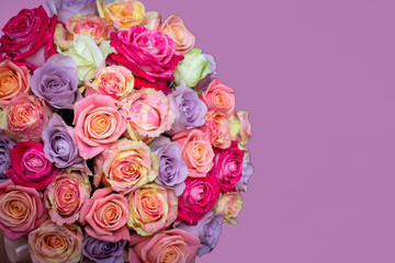 Beautiful bouquet of roses in a gift box. Bouquet of pink roses. Pink roses close-up. on pink background, with space for text.
